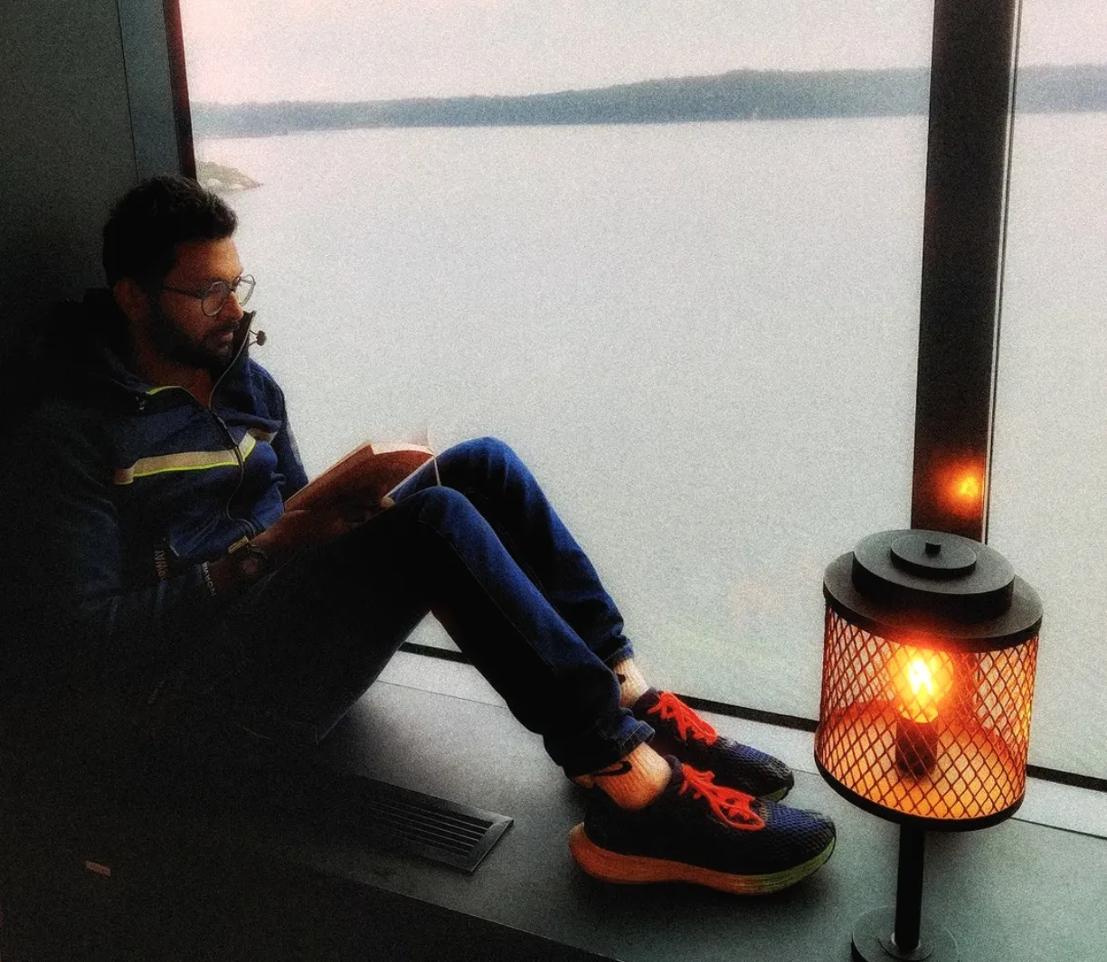Manoj reading a book in a cruise